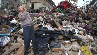 George W. Bush Climbs Rubble in Bangladesh