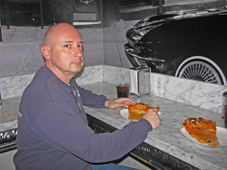 Bald Tony enjoys a secret slice